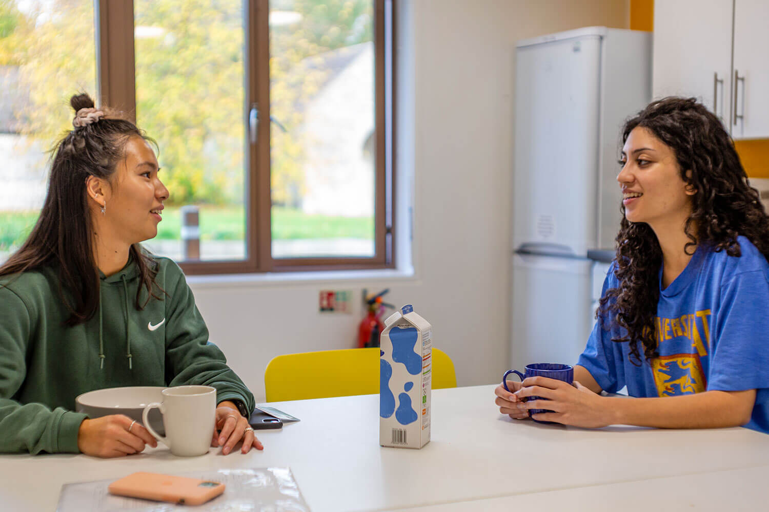 Students talking in a shared student kitchen
