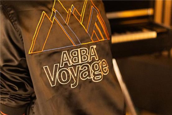 A close up shot of a jacket that reads 'ABBA Voyage'