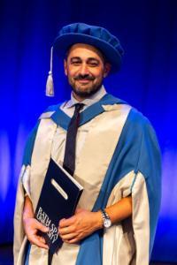 Adam Rutherford with his honorary doctorate