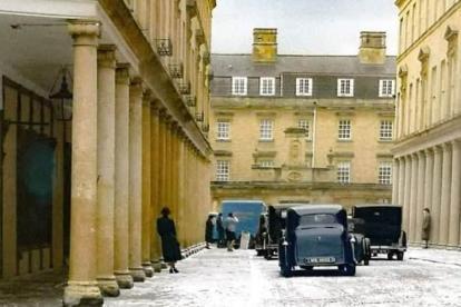 A snowy street with black cabs