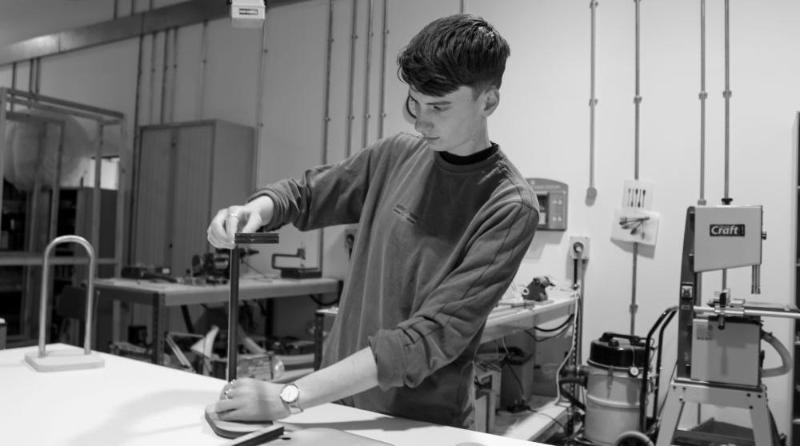 Student Bo Neville working on a design