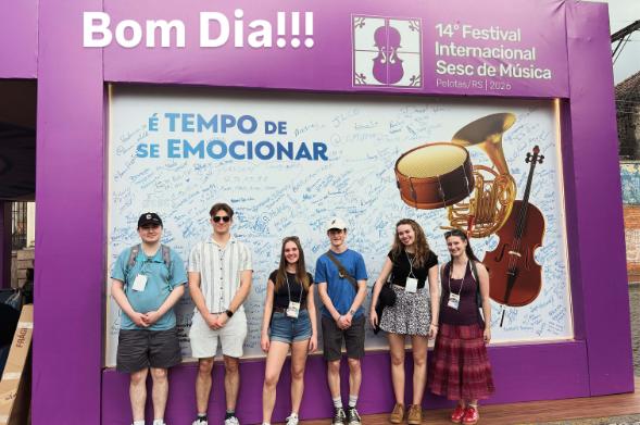 A group of students posing for a photo at a Brazilian music festival