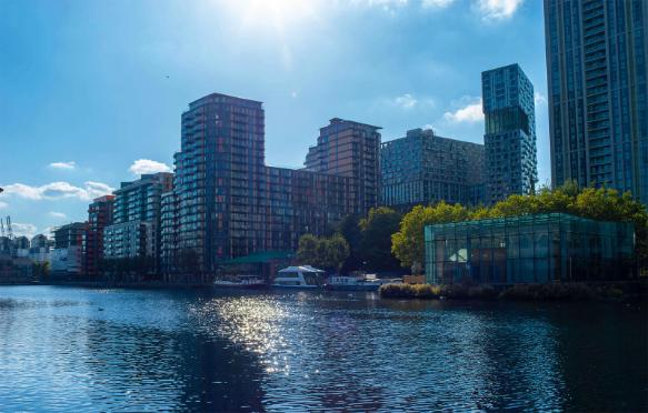 The river Thames set against large glass buildings