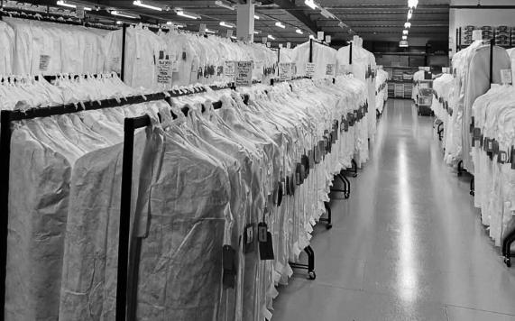 A black and white picture of a long clothes rack