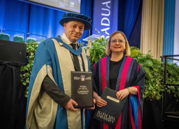 Demianchuk and Georgina Andrews in academic robes