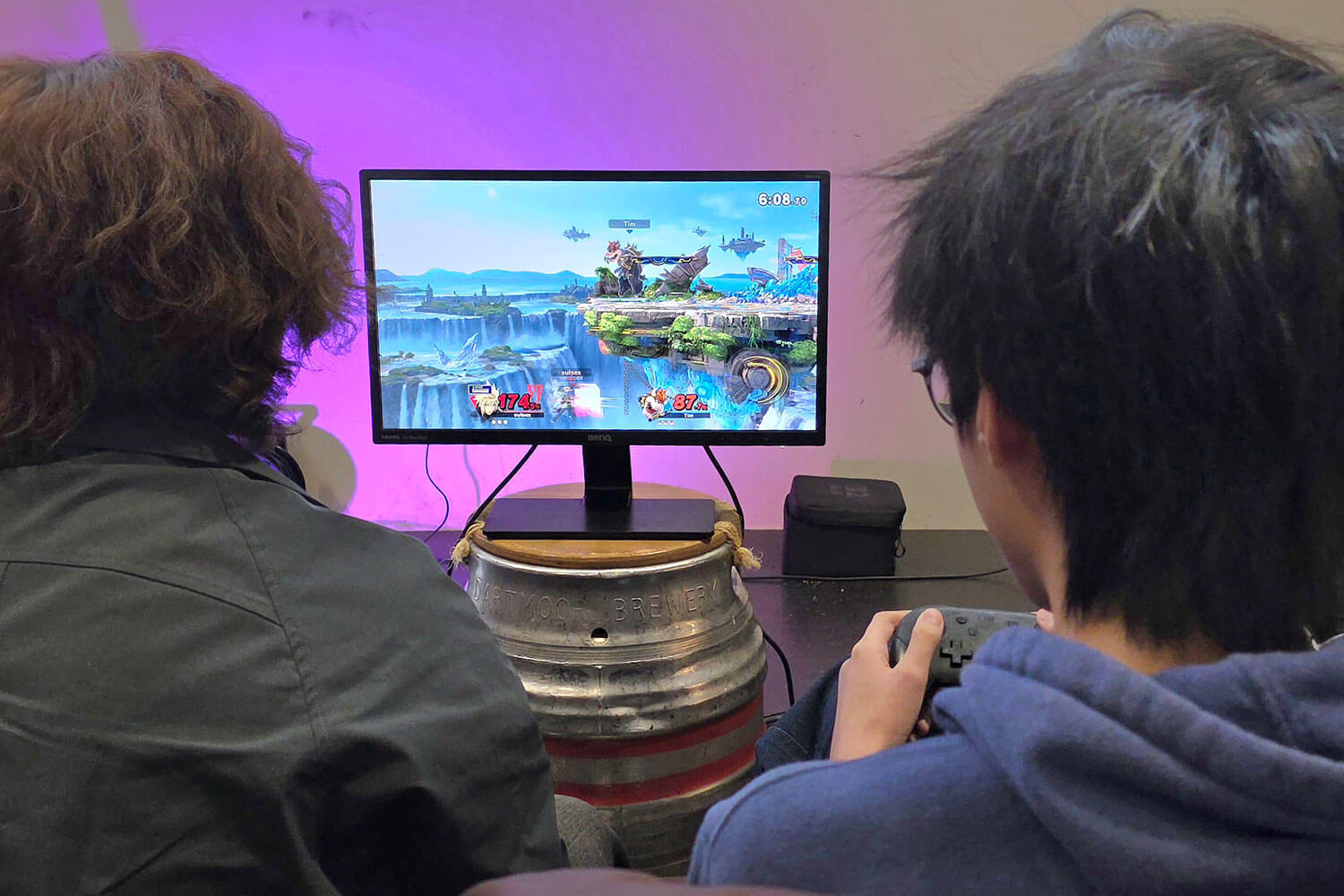 two people playing Super Smash Bros. on a console