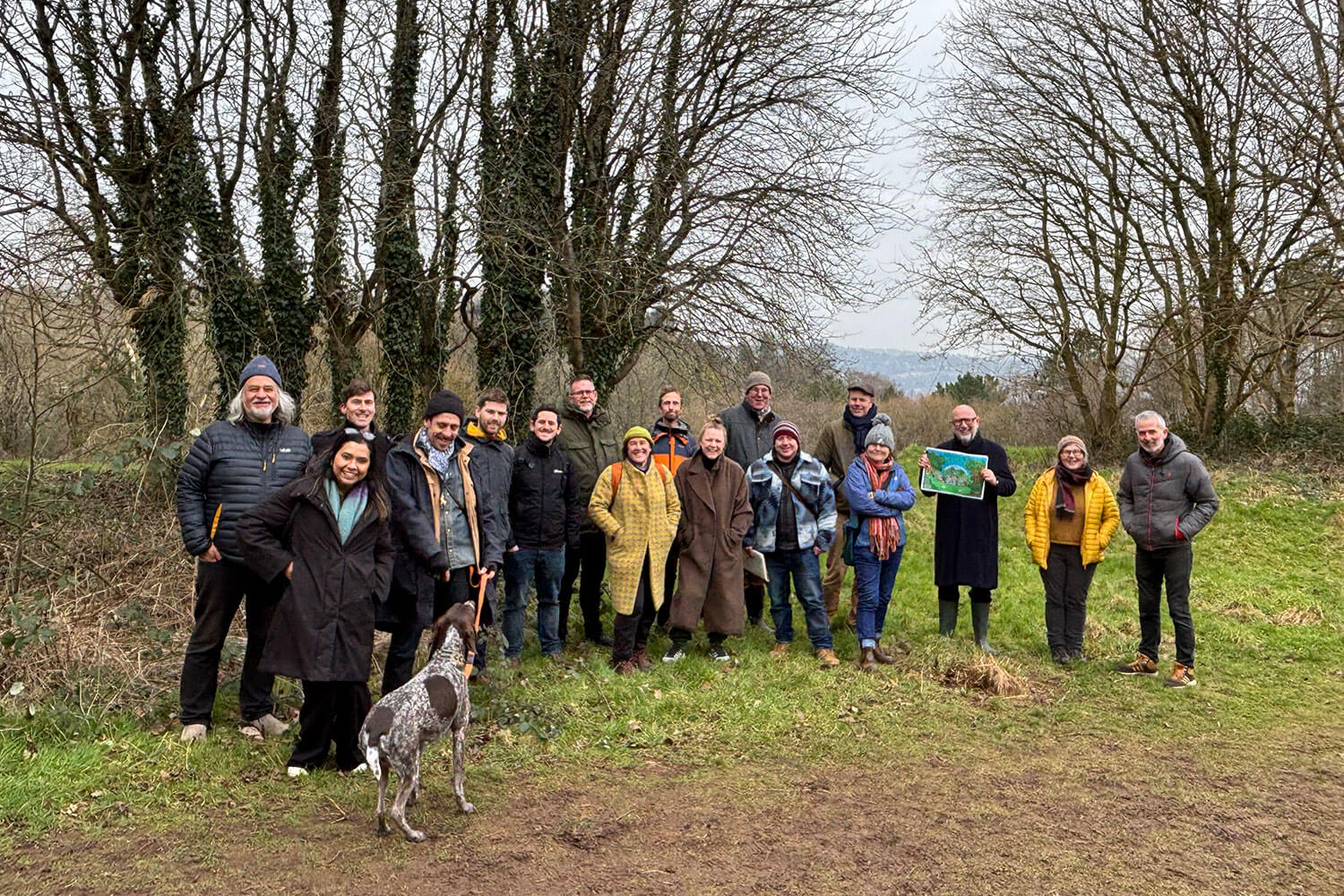 A group of people stood in a forest