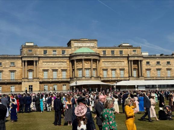 Buckingham Palace gardens with guests milling around