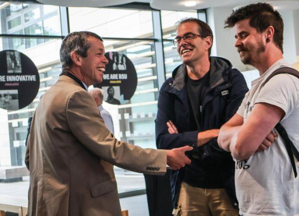 People shaking hands and chatting