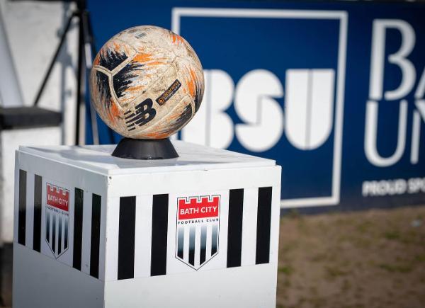 A football sat on a Bath City plinth with the Bath City logo behind