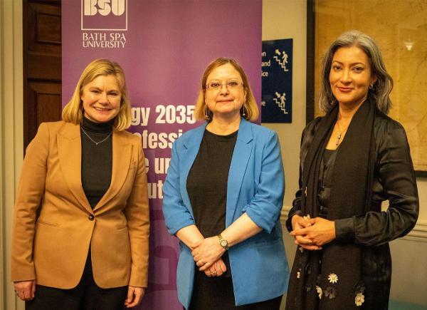 three people smartly dressed stood in front of a BSU branded banner announcing new strategy