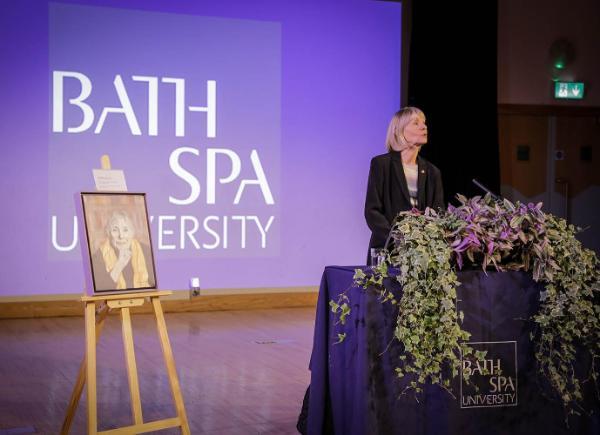 Writer Kate Mosse speaks at a podium in the Michael Tippett Centre