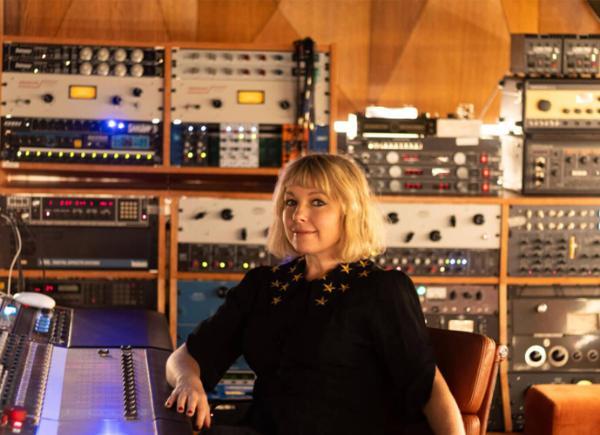 Person sits at mixing desk in BSU's commercial music studio