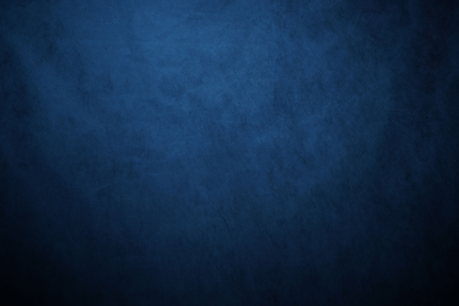 Blue textured background, ranging from mid blue to navy blue.
