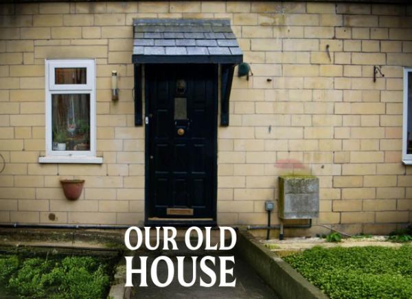 A front door with the words our old house overlayed