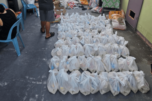 Bags of donated supplies lined up in rows