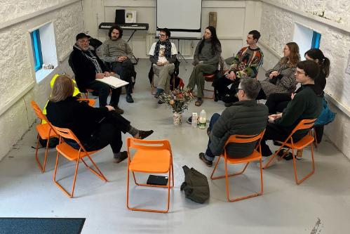 A group of students sitting in a circle