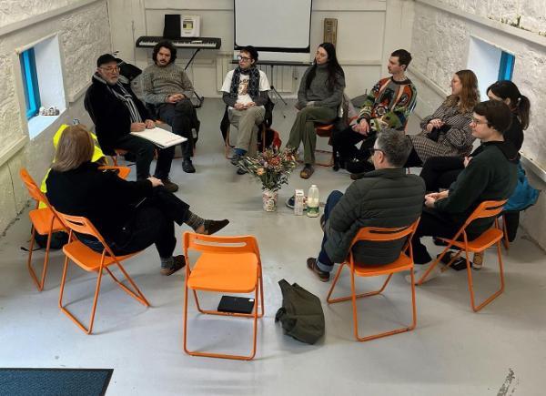 A group of students sitting in a circle