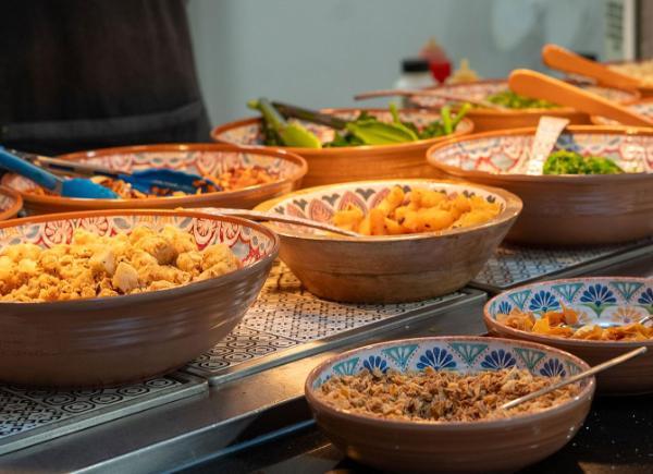 Bowls of food along a food counter