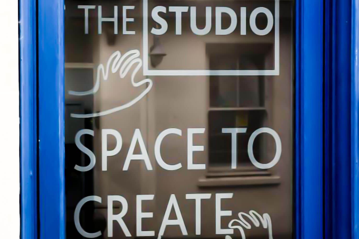 The front door of The Studio with a logo and the words 'space to create'