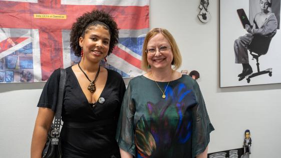 VC Award winner stands with BSU Vice-Chancellor for a photo in front of their work