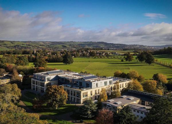 A drone image of commons building in the sun