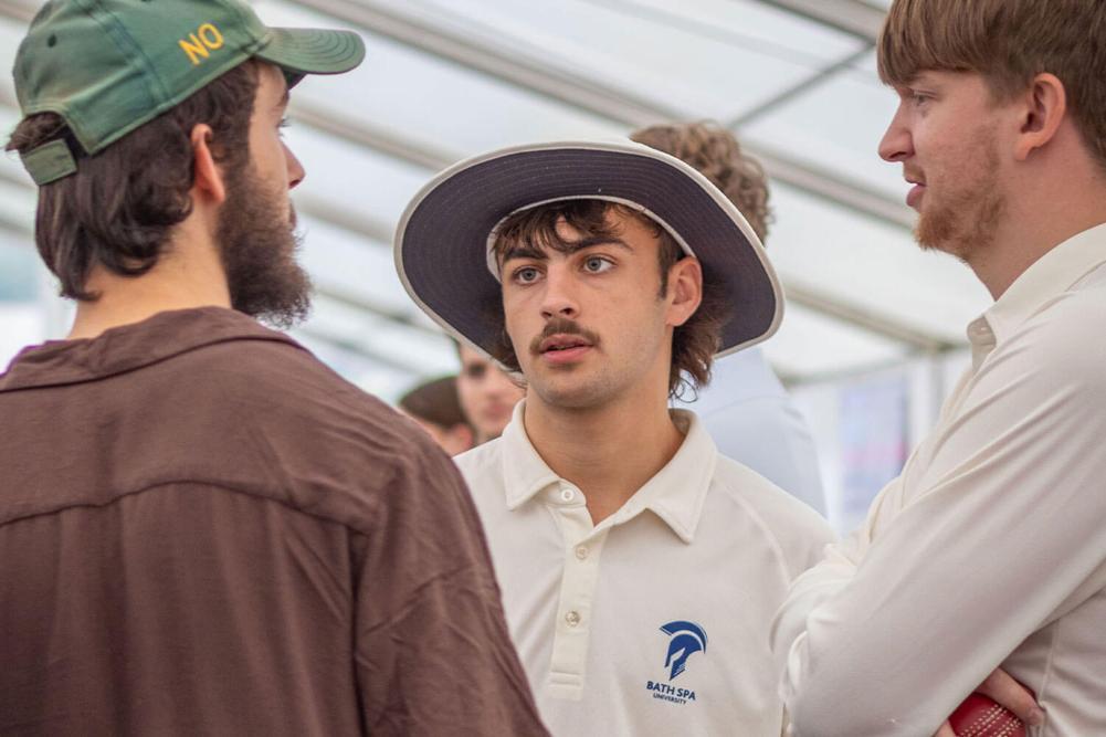 people in a marquee talking