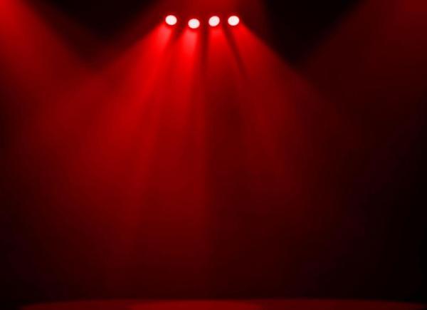 An empty stage under red lighting