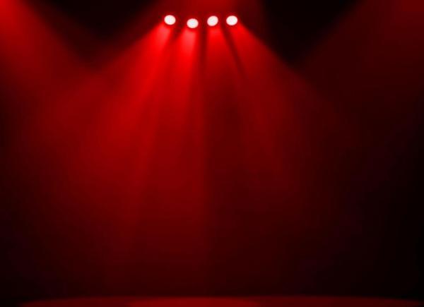 An empty stage under red lighting