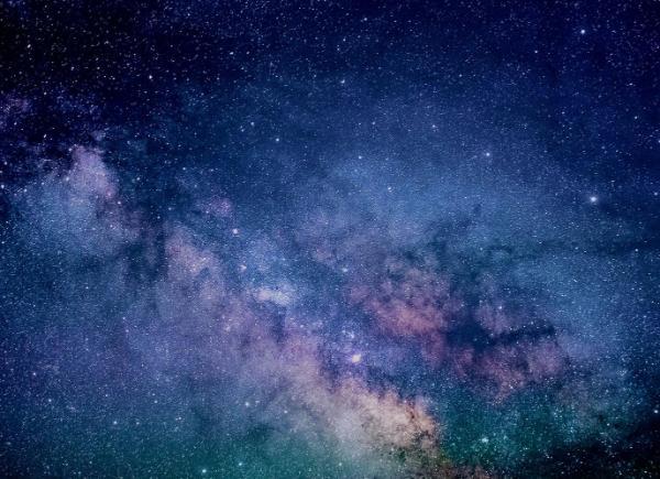 A image of the cosmos - millions of tiny stars in different constellations on the background of a night sky