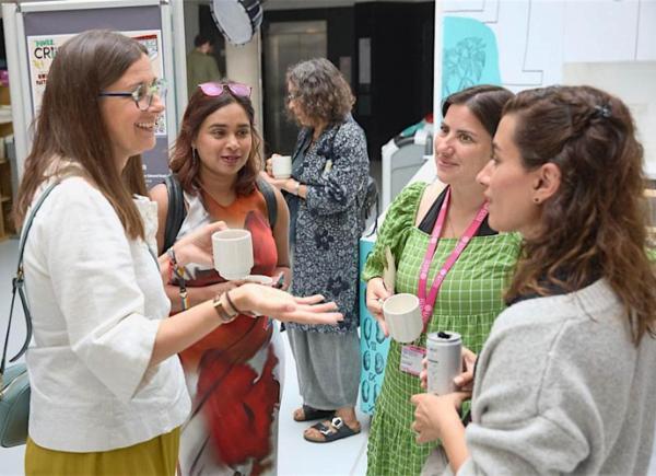 Photo of group of people socialising at an event.
