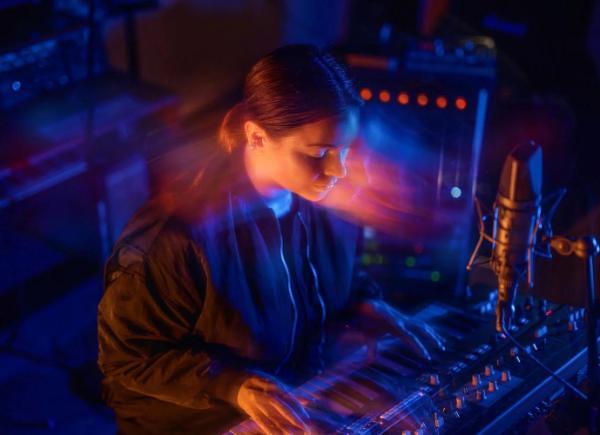 Image of young woman at mixing desk