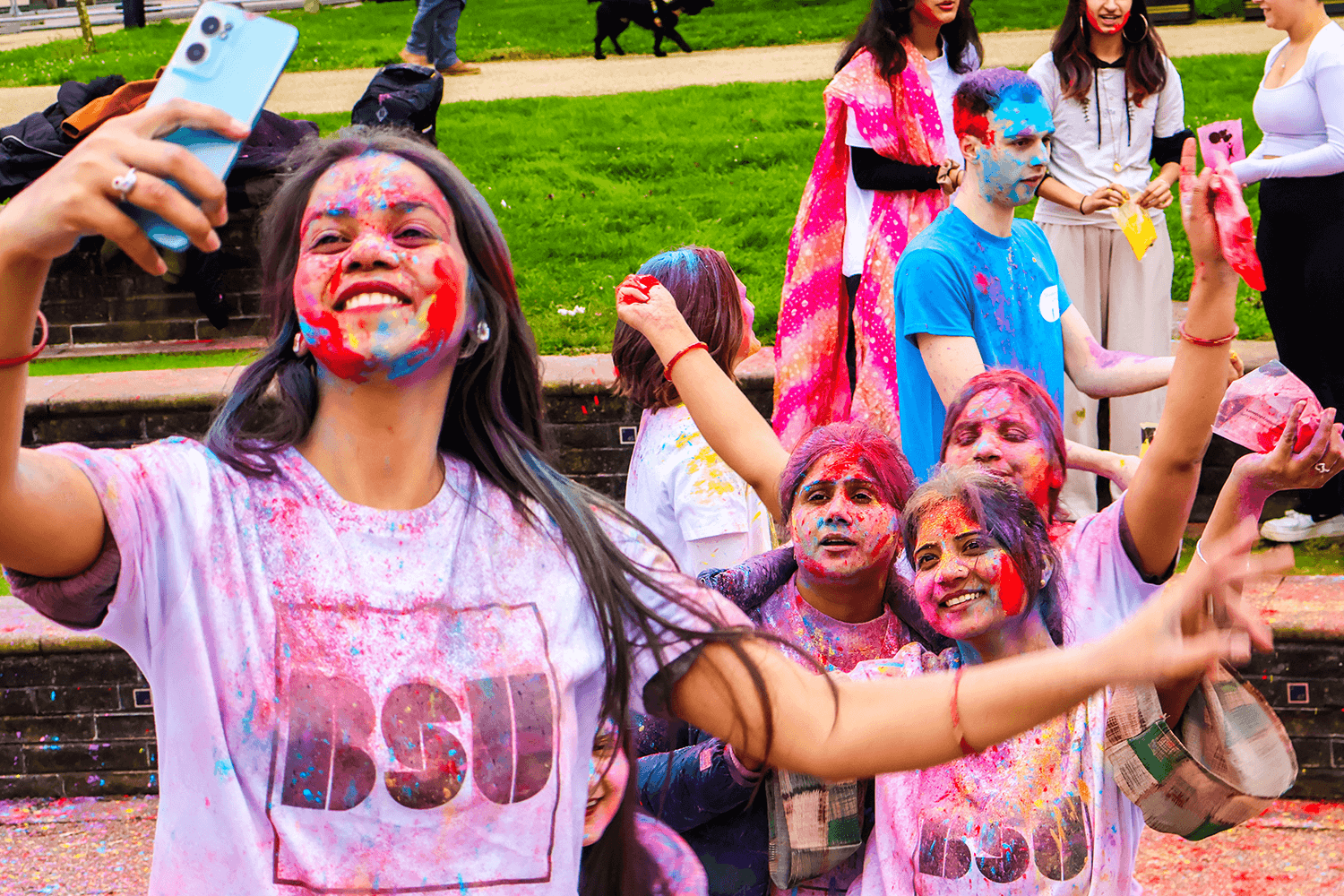 A group of students taking a selfie at a Festival of Holi event