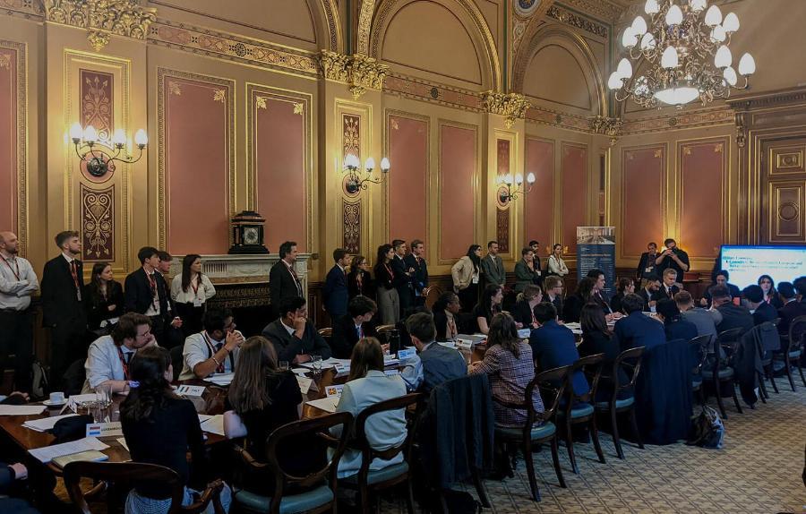 Students at the model Nato event sit around a large table