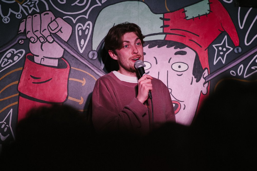 Student speaking into a microphone
