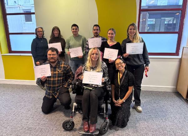 A group of skills bootcamp student holding certificates