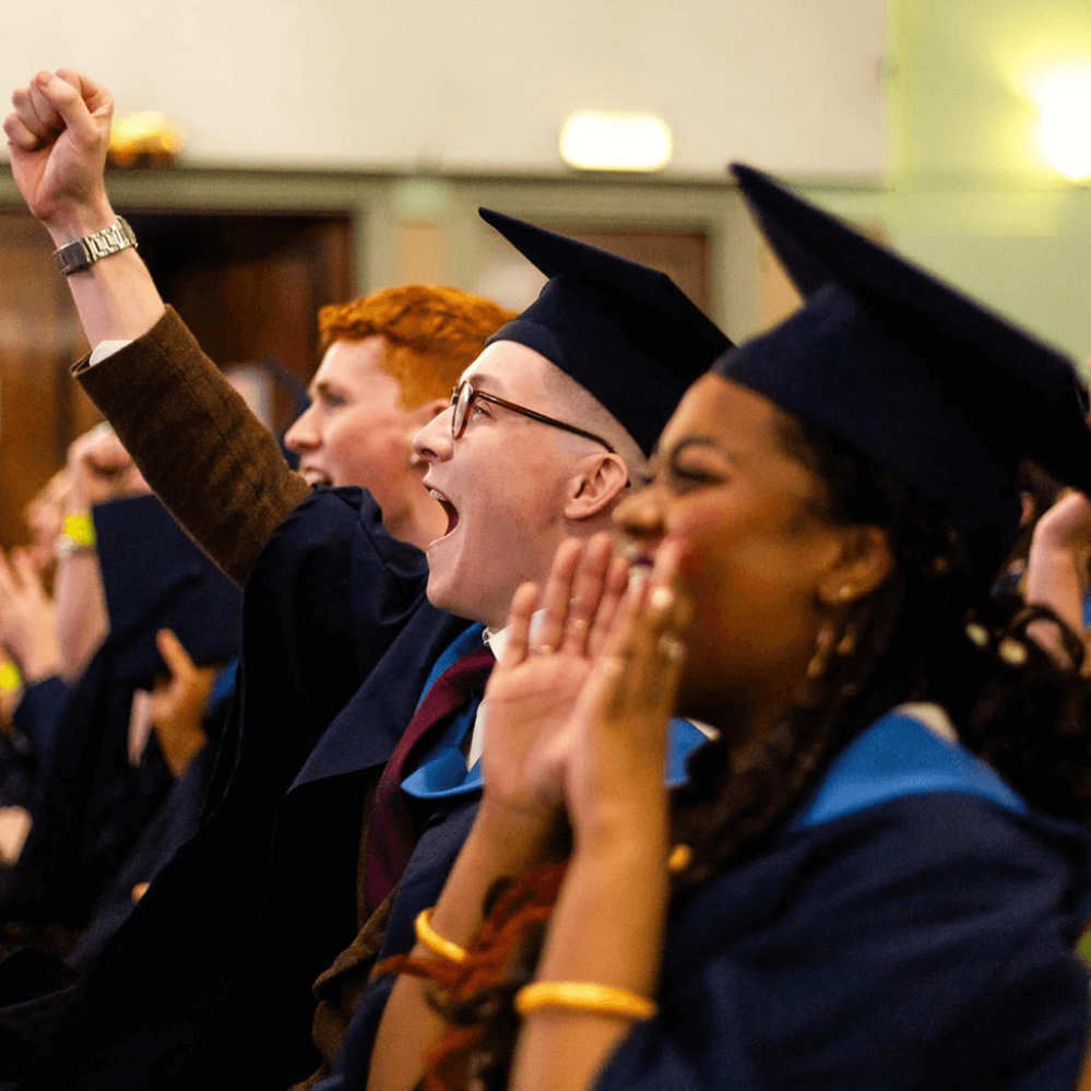 studentsatgraduationcheering2999x999.png