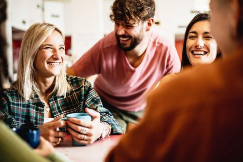A group of students laughing and talking