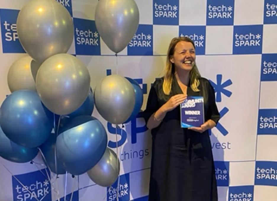 A picture of the Enterprise and Innovation Hub Manager with the 2022 SPARKies Community Award