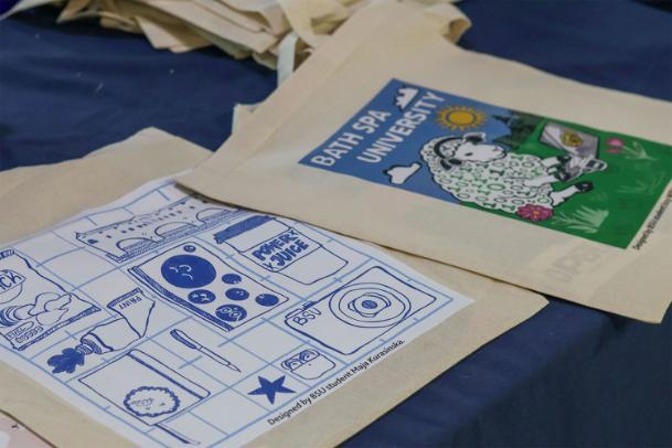 Two tote bags on a table next to each other