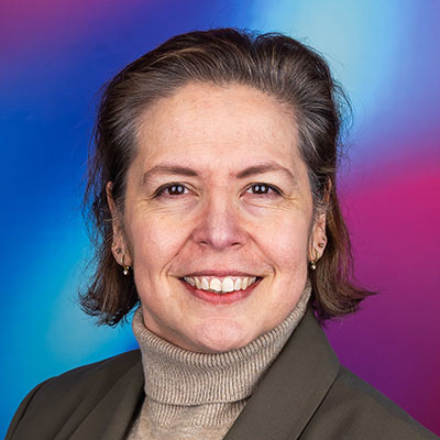 A headshot for a person with a short brown bob