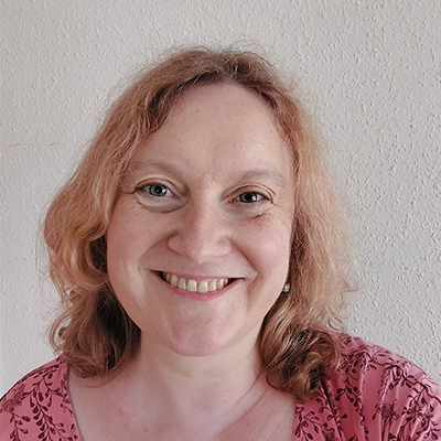 Headshot of someone with shoulder length light brown hair