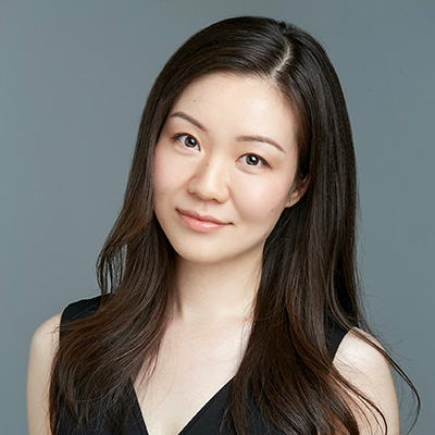 A profile picture of a Bath Spa university lecturer standing against a grey background.