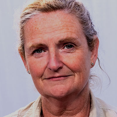 Smiling woman with hair pulled back into a bun