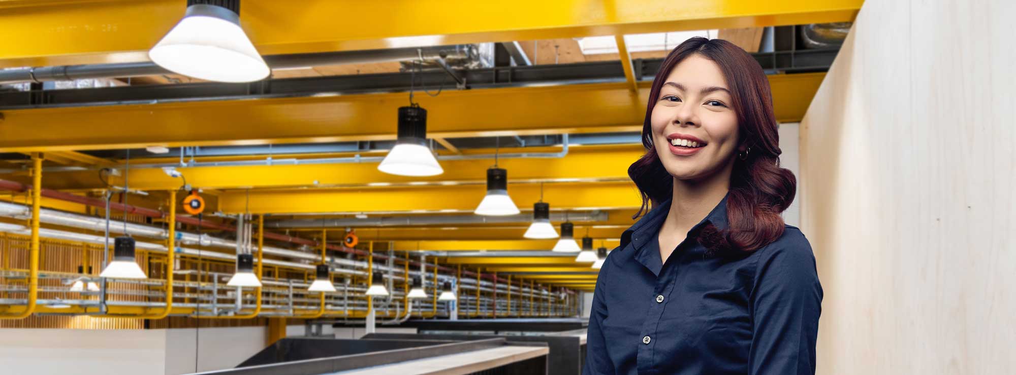 Image of smiling student on first floor of Locksbrook Campus