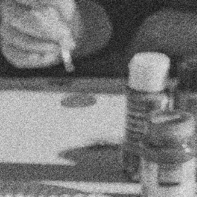 Close up in grainy greyscale of desk with art tools as in a classroom