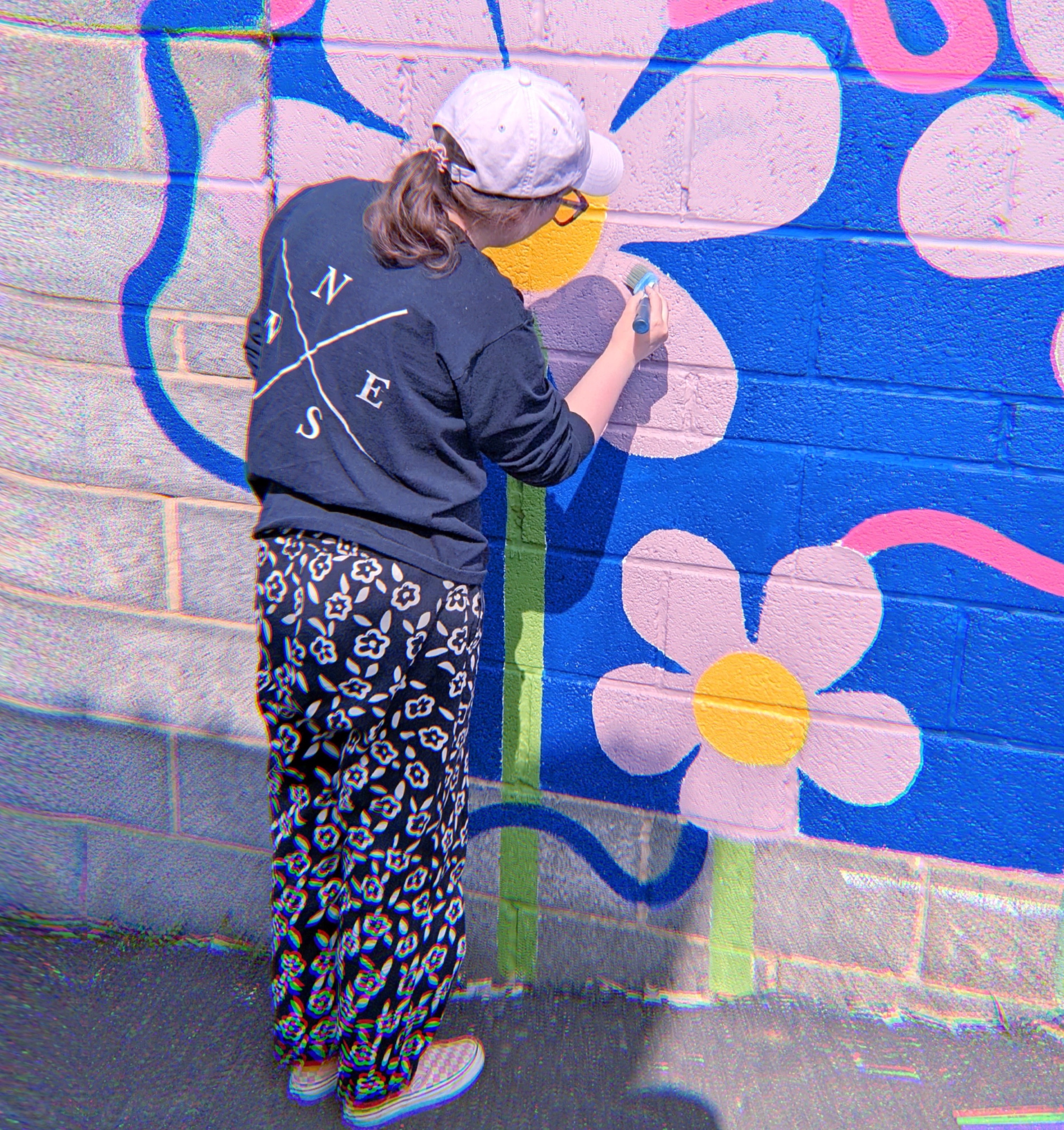 A person painting street art