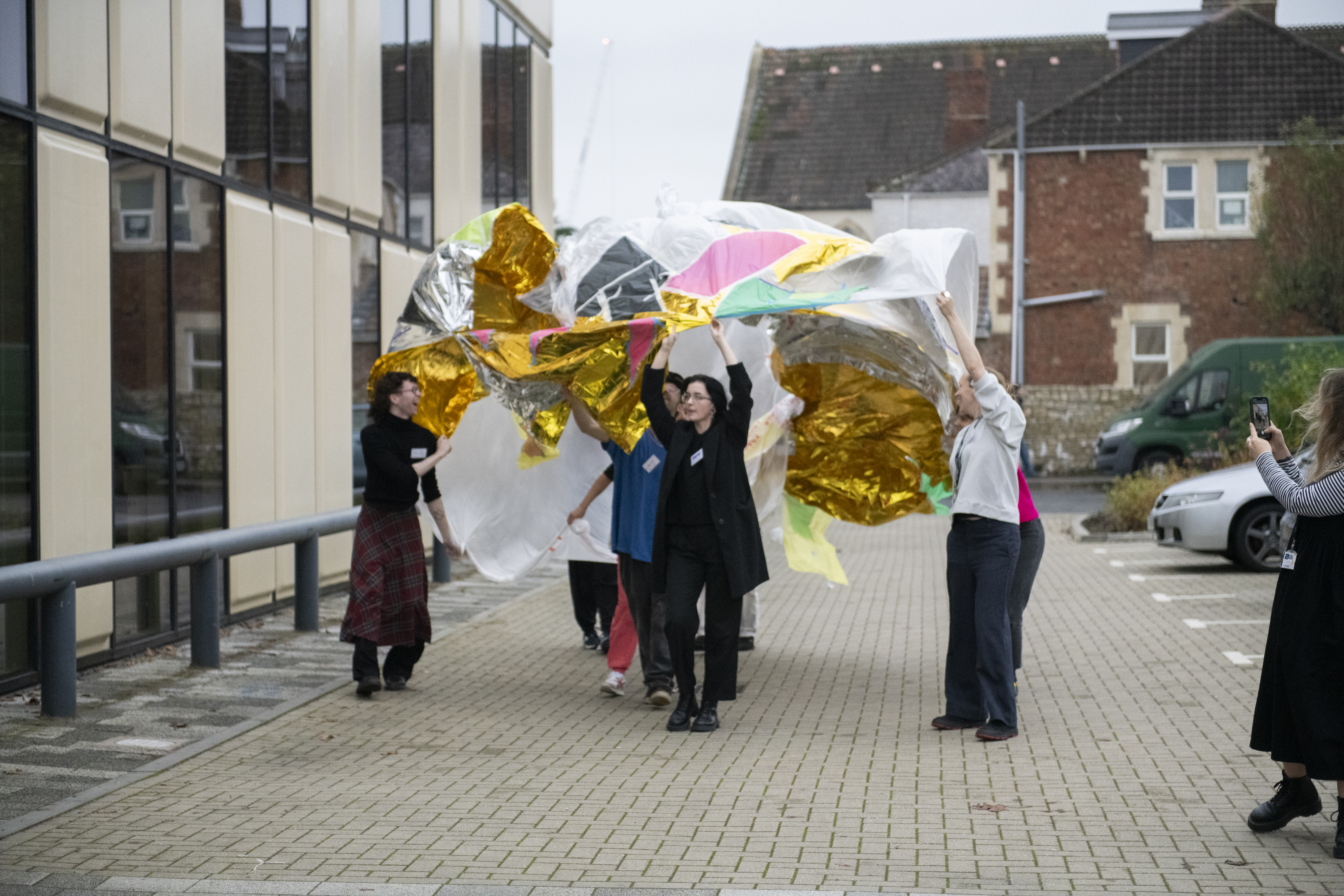 A group of people engaging in a group activity outside Locksbrook