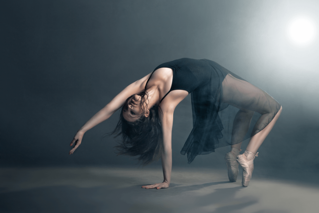 A student in motion of a somersault