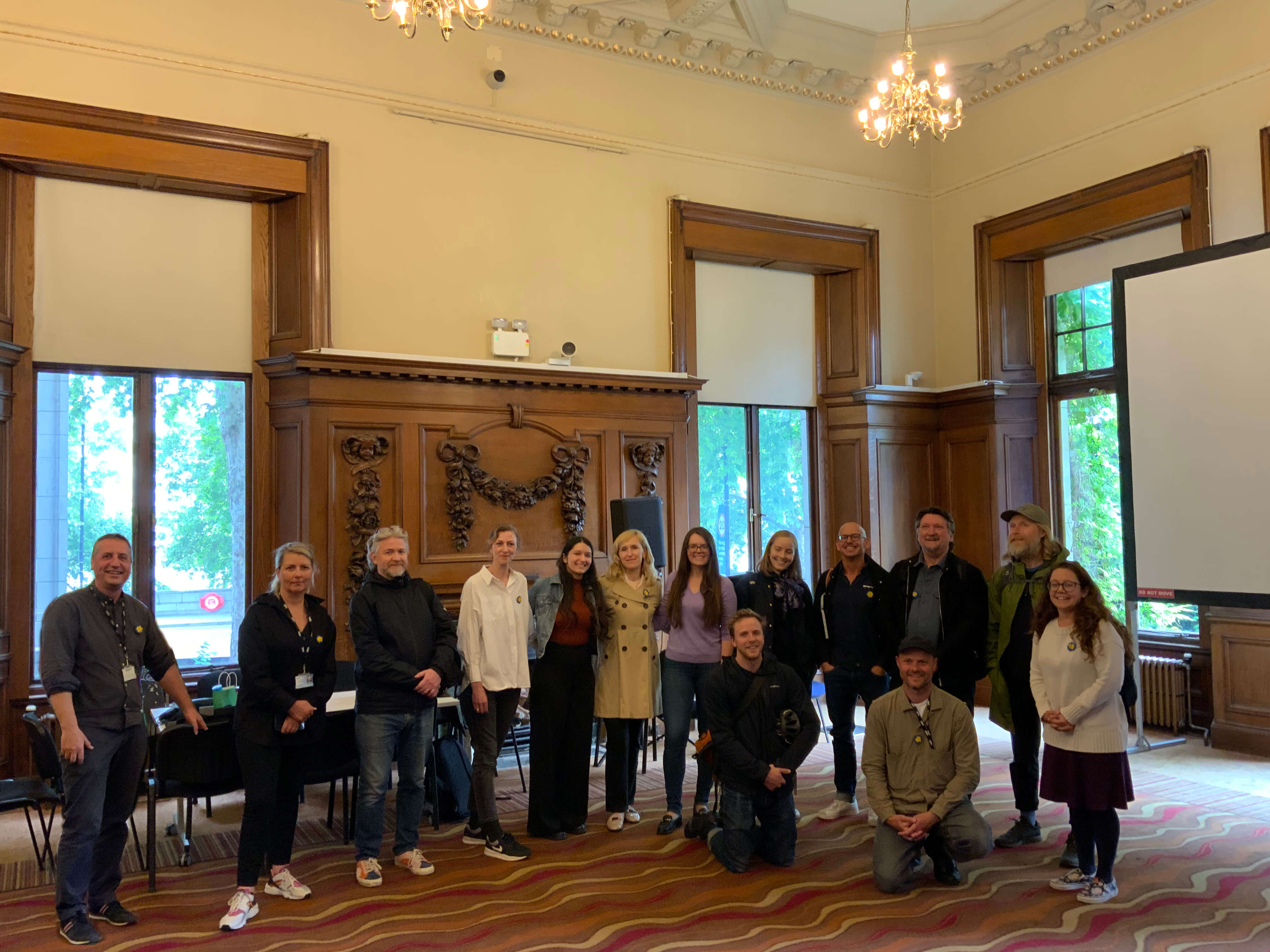 A large group of staff members pose for a group photo